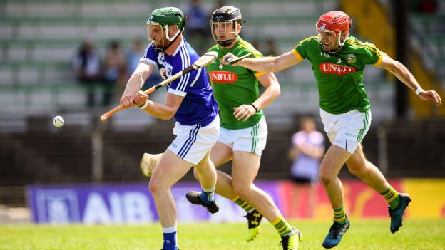 Neil Foyle of Laois in action against Darragh Kelly and Seán Geraghty, right, of Meath during the Joe McDonagh Cup Round 5 match between Meath and Laois at Páirc Táilteann in Navan, Co Meath