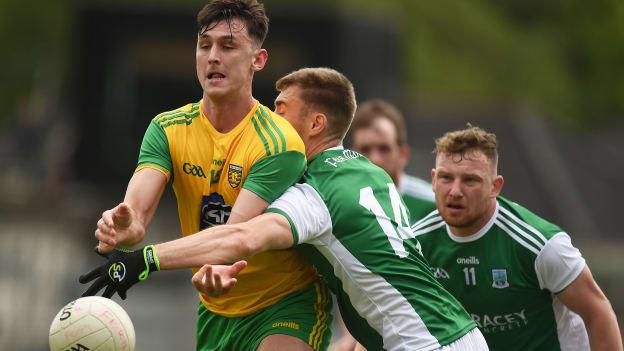 Michael Langan of Donegal in action against Conall Jones of Fermanagh during the Ulster GAA Football Senior Championship Quarter-Final match between Fermanagh and Donegal at Brewster Park in Enniskillen, Fermanagh. 