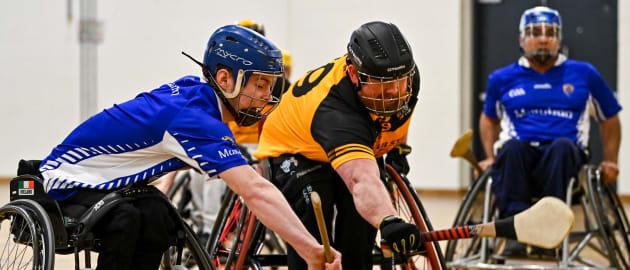 Cian Horgan of Munster in action against Ciarán Bradley of Ulster during the M.Donnelly GAA Wheelchair Hurling / Camogie All-Ireland Finals 2022 match between Ulster and Munster at Ashbourne Community School in Ashbourne, Meath.