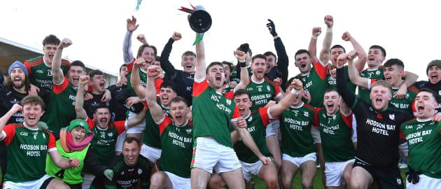 St. Brigid's joint-captain Paul McGrath lifts the Shane McGettigan cup as he celebrates with team-mates after their side's victory over Corofin at Dr. Hyde Park this afternoon. 