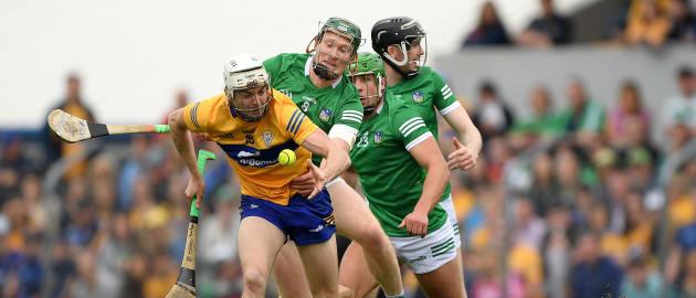 Ryan Taylor of Clare is tackled by William O'Donogue of Limerick during the Munster GAA Hurling Senior Championship Round 4 match between Clare and Limerick at Cusack Park in Ennis, Clare. 