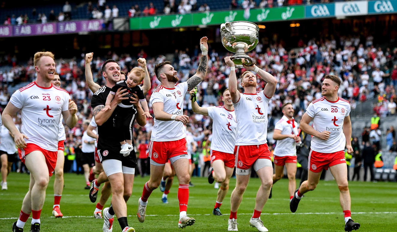 Tyrone players, led by Frank Burns celebrate with the Sam Maguire Cup after their side's victory over Mayo in the GAA Football All-Ireland Senior Championship Final match at Croke Park in Dublin. 