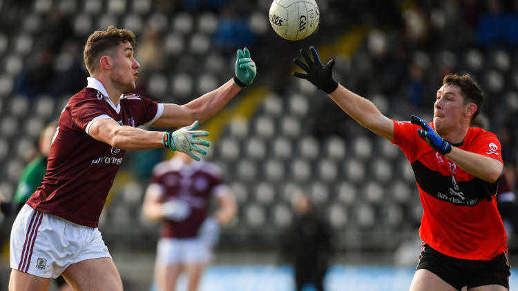 Michael Daly, NUIG, and Michael Flood, UCC, in Electric Ireland Sigerson Cup action at Mallow.