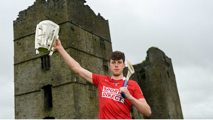 Robert Downey of Cork poses for a portrait with the Liam MacCarthy Cup at Loughmore Castle at the GAA Hurling All-Ireland Senior Championship Series national launch in Tipperary.