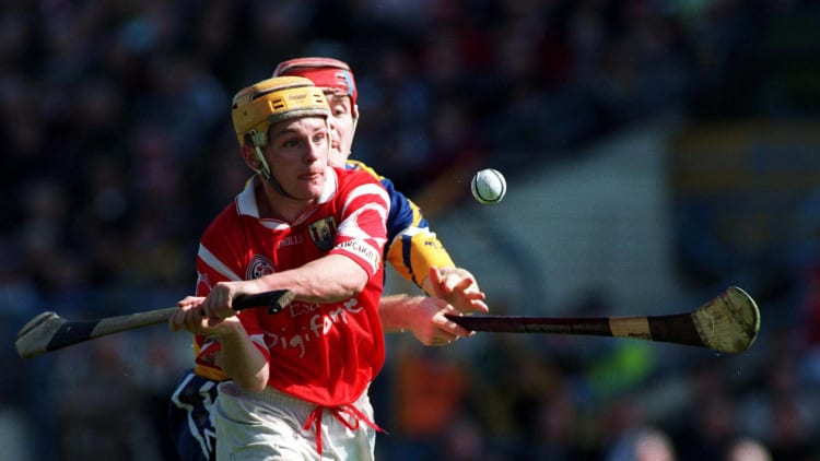 Joe Deane, Cork, and Brian Lohan, Clare, during the 1998 Allianz Hurling League Semi-Final at Semple Stadium.