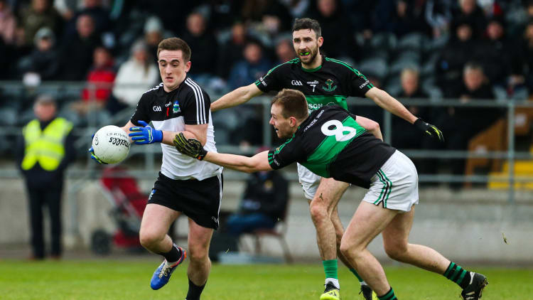 Stephen Brosnan, Newcastle West, and Alan O'Donovan, Nemo Rangers, during the AIB Munster Club SFC encounter at Mallow.