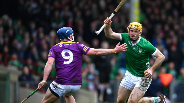 Richie English, Limerick, and Kevin Foley, Wexford, in Allianz Hurling League action. Photo by Tyler Miller/Sportsfile