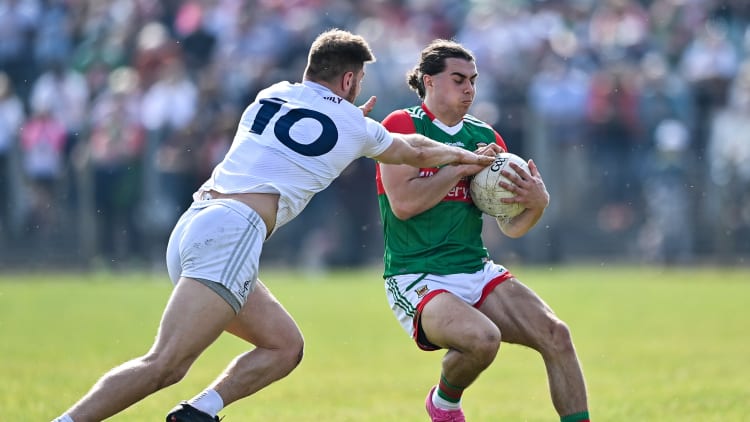 Oisín Mullin, Mayo, and Kevin O'Callaghan, Kildare, in Allianz Football League action.