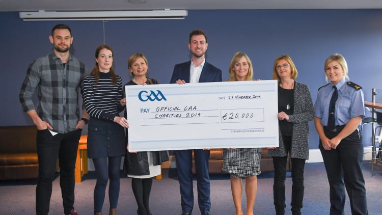 GAA representative Kevin Sexton, left, and member of An Garda Síochána Jen Keegan, right, present a cheque to, from left, Deidre Walsh of Western Alzheimers, Liz Yates of the Marie Keating Foundation, Donal Kitt of Enable Ireland and Ciara Carty and Elaine Fleming of Focus Ireland during the GAA Charities Cheque Handover at Canal Café in Croke Park.
