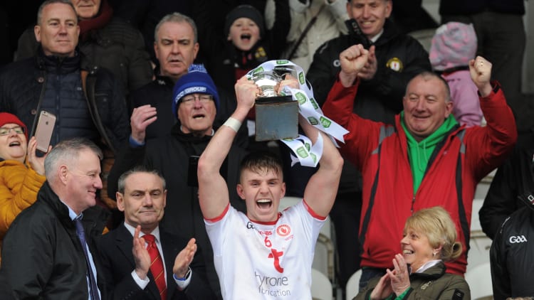 Tyrone captain Antoin Fox raises the Danny Murphy Cup.