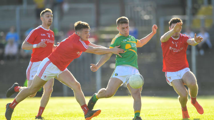 Louth's Darren Marks attempts to block down Leitrim's Darragh Rooney at Pairc Sean MacDiarmada.