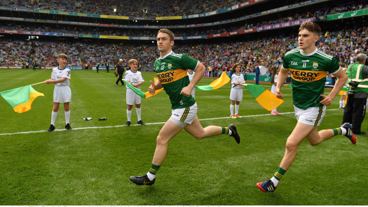 Kenmare Shamrocks clubmates Stephen O'Brien (left) and Sean O'Shea run out onto the pitch before the drawn 2019 All-Ireland SFC Final against Dublin.