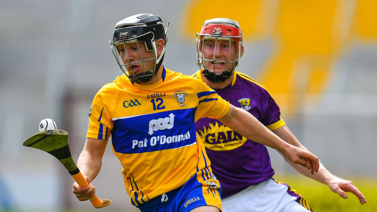 David Reidy, Clare, and Diarmuid O'Keeffe, Wexford, in All Ireland SHC Quarter-Final action at Pairc Ui Chaoimh.