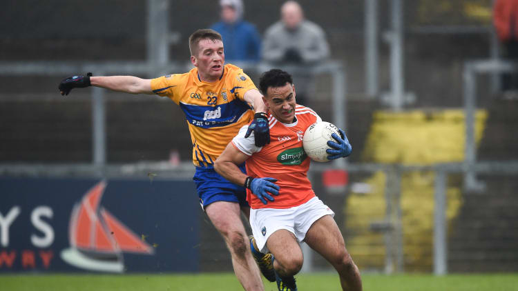 Jemar Hall of Armagh in action against Dale Masterson of Clare during the Allianz Football League Division 2 Round 2 match between Armagh and Clare at Páirc Esler in Newry, County Down.
