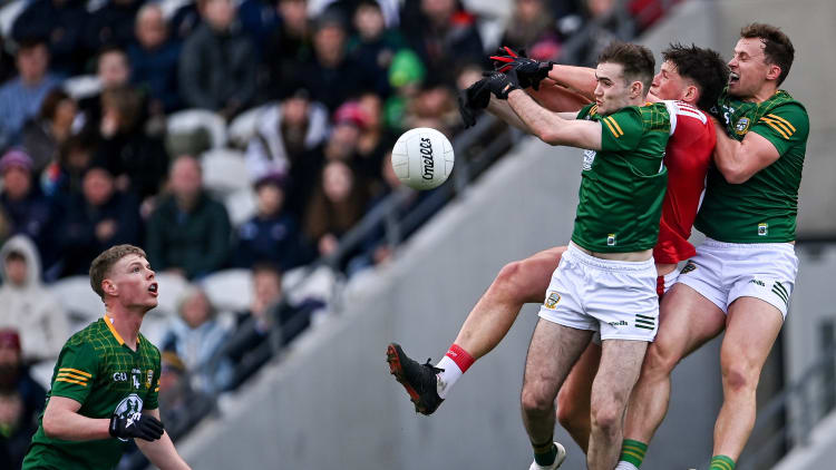 Colm O'Callaghan of Cork in action against Meath players Ronan Jones, right, and Cathal Hickey as Mathew Costello, far left, looks on during the Allianz Football League Division 2 match between Cork and Meath at Páirc Ui Chaoimh in Cork.
