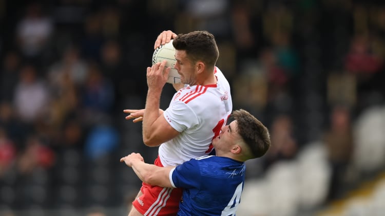 Darren McCurry, Tyrone, and Cian Reilly, Cavan, in Ulster SFC action.