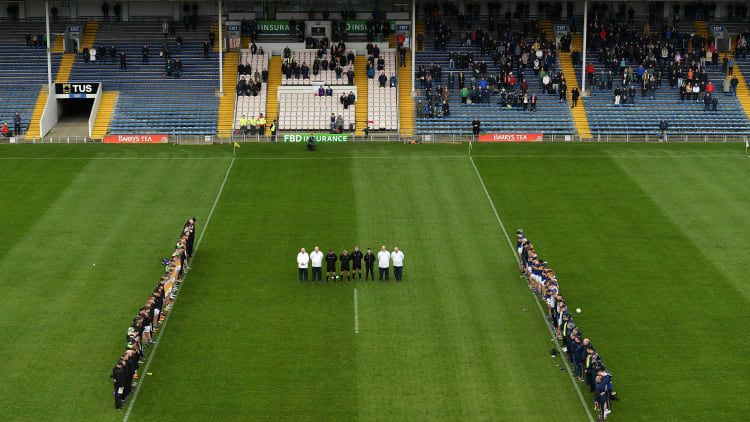 Referee James Molloy, his officials and members of both squads and management, stand during a minutes silence to honour the late Liam Kearns before the Allianz Football League Division Three match between Tipperary and Offaly this afternoon.