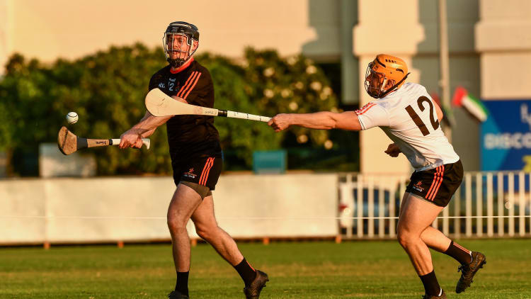 Donegal's Declan Coulter of the 2018 PwC All-Stars in action against Laois' Enda Rowland of 2019 PwC All-Stars during the PwC All Star Hurling Tour 2019 All Star game at Zayed Sport City in Abu Dhabi, United Arab Emirates.