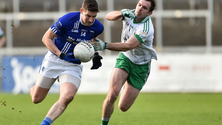 Darren Hughes of Scotstown in action against Declan Rooney of Burren during the AIB Ulster GAA Football Senior Club Championship quarter-final match between Burren and Scotstown at Páirc Esler in Newry, Down.
