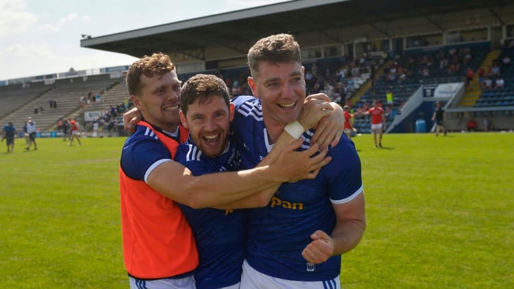 Shane Briody (right) celebrates his county's last-ditch victory over Louth in the semi-final of the Lory Meaghar Cup.