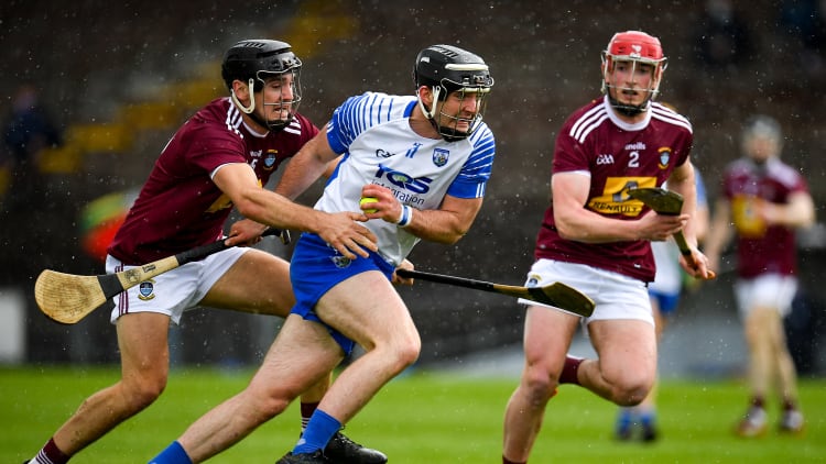 Patrick Curran, Waterford, and Aonghus Clarke, Westmeath, collide at Walsh Park.