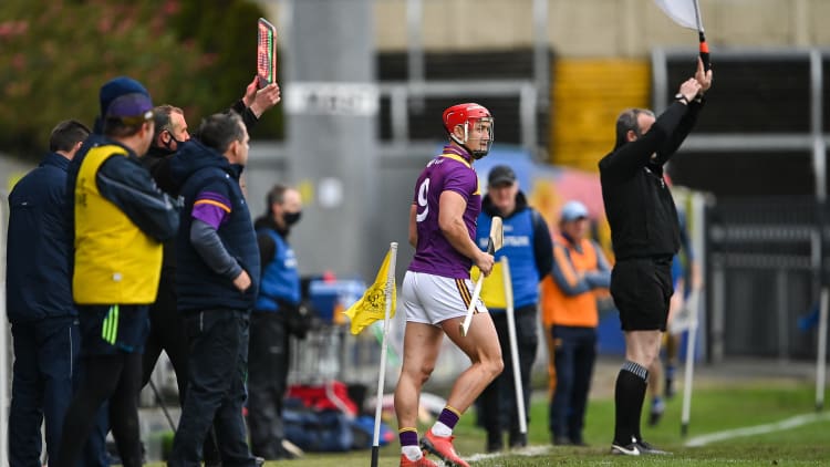 Lee Chin of Wexford prepares to come on as a substitute during the GAA Hurling All-Ireland Senior Championship Qualifier Round 2 match between Wexford and Clare at MW Hire O'Moore Park in Portlaoise, Laois.