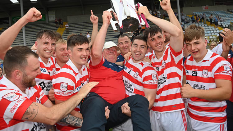 Ferns St Aidan's manager Pat Bennett celebrates with his team and the trophy after the Wexford County Senior Hurling Championship Final match between St Martin's and Ferns St Aidan's at Chadwicks Wexford Park in Wexford.