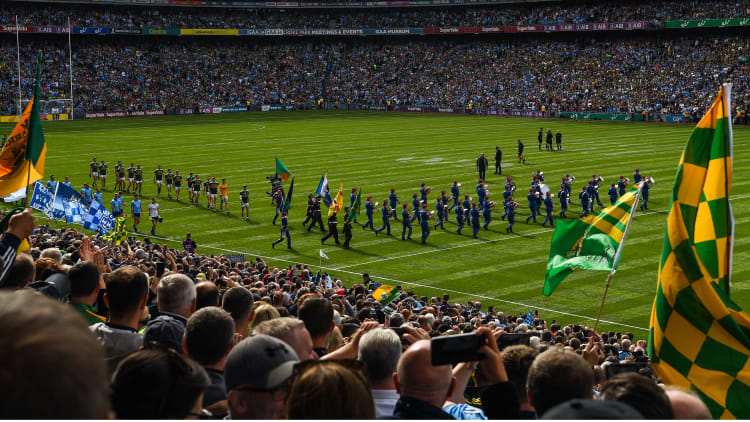The Artane Band lead Kerry and Dublin on the pre-match parade before the drawn All Ireland SFC Final at Croke Park.