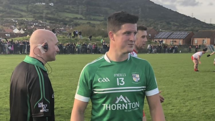 Tomás McCann secured a draw for Cargin against Lámh Dhearg in the Antrim SFC Final with a late point.