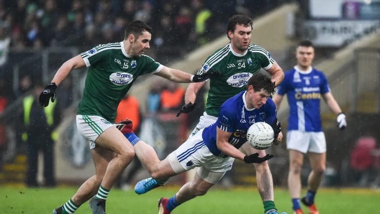 Darren Hughes, Scotstown, challenged by Gaoth Dobhair's Michael Carroll and Eamonn McGee at Healy Park.