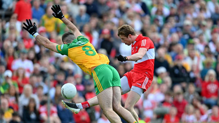 Brendan Rogers, Derry, and Caolan McGonagle, Donegal, in action during the Ulster SFC Final.