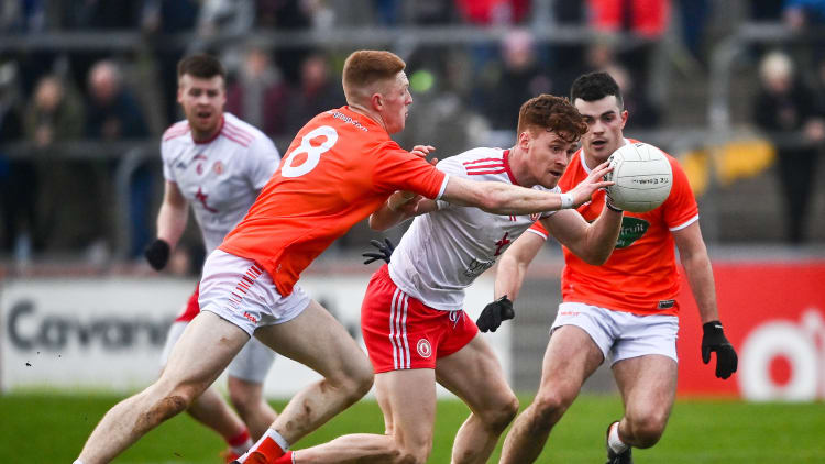 Conor Meyler, Tyrone, and Ciaran Mackin, Armagh, collide at O'Neill's Healy Park in the Dr McKenna Cup.