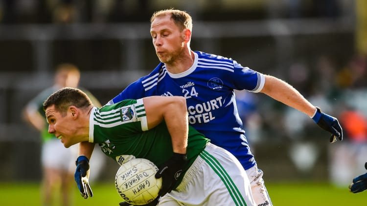 Kevin Cassidy, Gaoth Dobhair, and Anthony Thompson, Naomh Conaill, during the Donegal SFC Final.