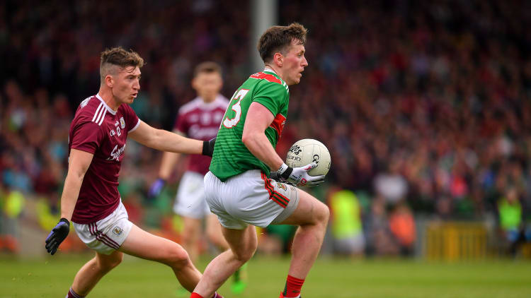 Cillian O'Connor, Mayo, and Johnny Heaney, Galway, during the 2019 All Ireland SFC Qualifier at the LIT Gaelic Grounds.