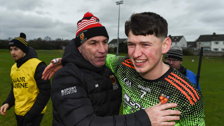 Niall Brassil of IT Carlow is congratulated by IT Carlow manager DJ Carey following the Fitzgibbon Cup Semi-Final match between Mary Immaculate College Limerick and IT Carlow at Dublin City University Sportsgrounds.