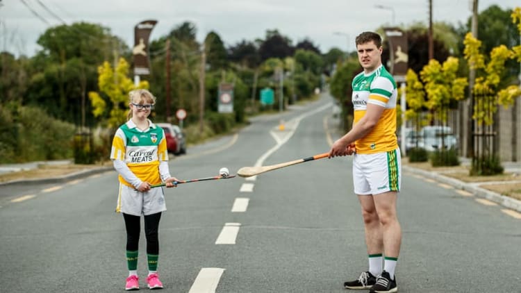 Ailis Malone pictured with Offaly senior hurler Cillian Kiely at the start of their solo run on Sunday morning.