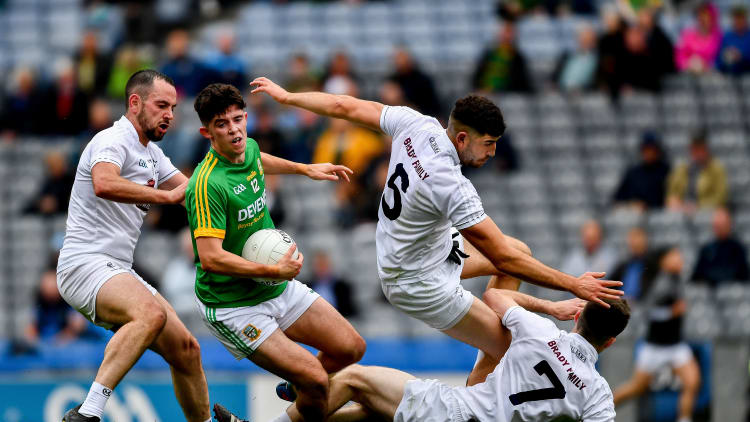 Jason Scully, Meath, in action against Kildare's Mark Grace, Omar Dunne, and Owen Whelan in the Leinster Junior Football Championship Final at Croke Park.