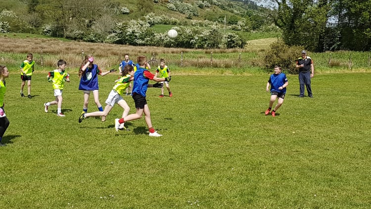 Boys and girls from Craggagh National School playing in the steep slopes of Sliabh Cairn in Balla, County Mayo.