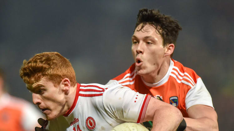Peter Harte, Tyrone, and James Morgan, Armagh, in action during the Bank of Ireland Dr McKenna Cup Final.