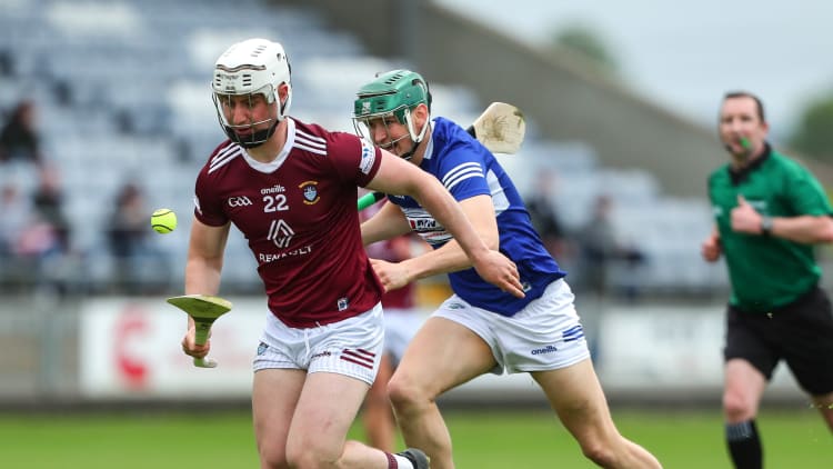 Eoin Keyes, Westmeath, and Seán Downey, Laois, in Leinster Senior Hurling Championship action.