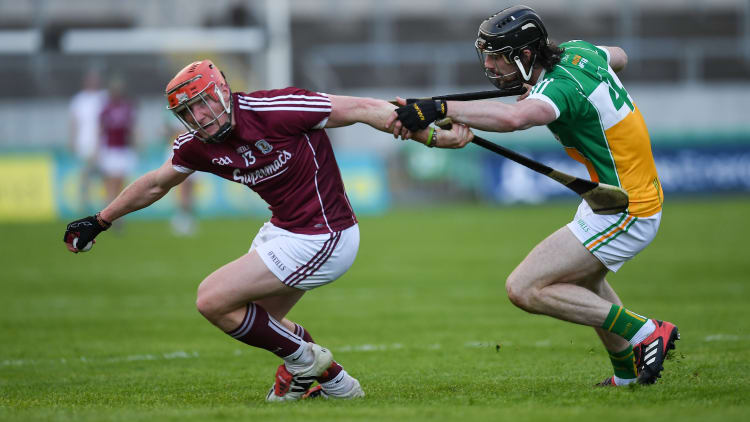 Conor Whelan, Galway, and Ben Conneely, Offaly, collide during the 2018 Leinster Senior Hurling Championship.
