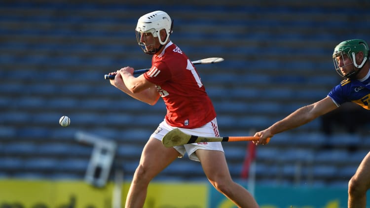 Robbie Cotter of Cork scores his side's second goal despite the efforts of Fintan Purcell of Tipperary during the Munster GAA Hurling U20 Championship semi-final match between Tipperary and Cork at Semple Stadium in Thurles, Tipperary.