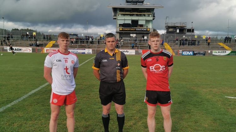 Tyrone captain Cormac Devlin and Down captain Tom Carroll line up before the throw in at Healy Park tonight.