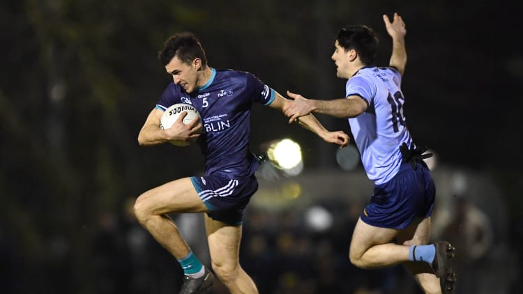 Cian Hanley, TU Dublin, and Pearse Ruttledge, UCD, in Electric Ireland Sigerson Cup action. Photo by Piaras Ó Mídheach/Sportsfile