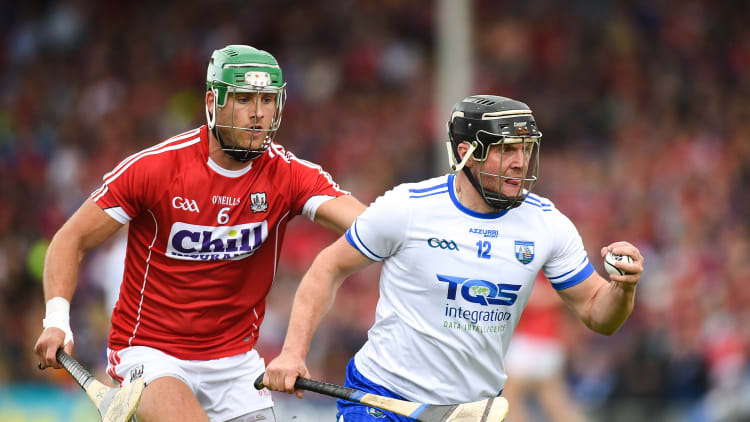 Jake Dillon, Waterford, and Eoin Cadogan, Cork, in Munster Senior Hurling Championship action at Semple Stadium.