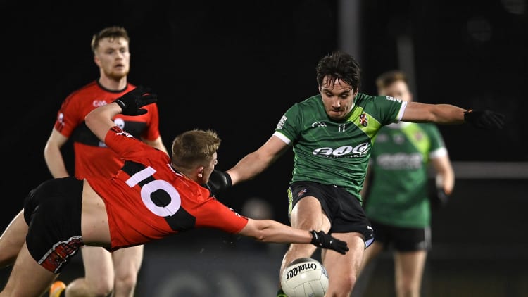 Patrick Finnegan, Queen's University, and Jack Murphy, UCC, in Electric Ireland Sigerson Cup action.