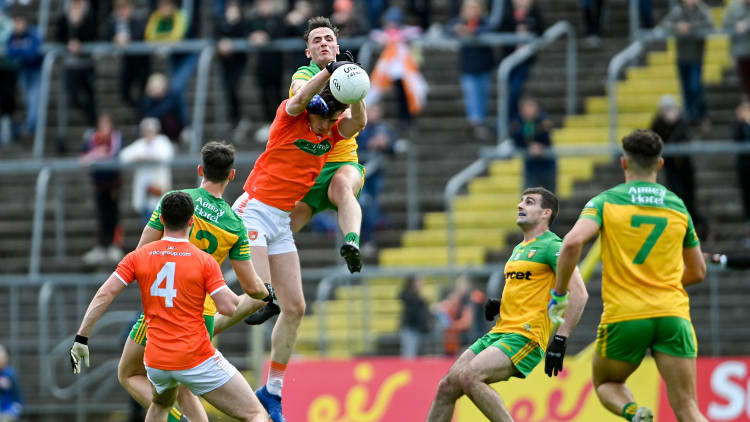 Ben Crealey, Armagh, and Jason McGee, Donegal, collide at St Tiernach's Park.