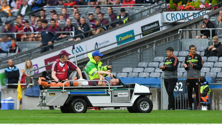 Paul Conroy of Galway is helped off the field on a stretcher after breaking his leg against Kerry in the All-Ireland SFC Quarter-Final.