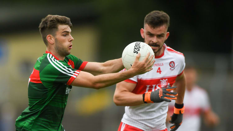 Oisin McLaughlin, Mayo, and Eoghan Concannon, Derry, in action at Pairc Sean MacDiarmada.
