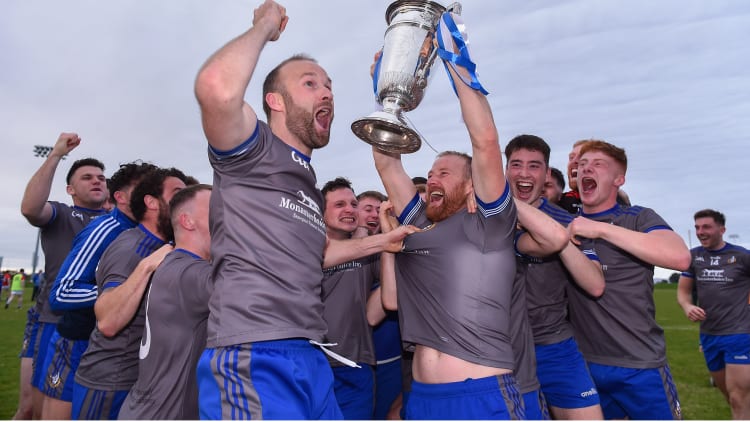 JP Rooney of Naomh Mairtin lifts the Joe Ward Cup alongside his team-mates following the Louth County Senior Football Championship Final match between Naomh Mairtin and Ardee St Mary’s at Darver Louth Centre of Excellence in Louth.